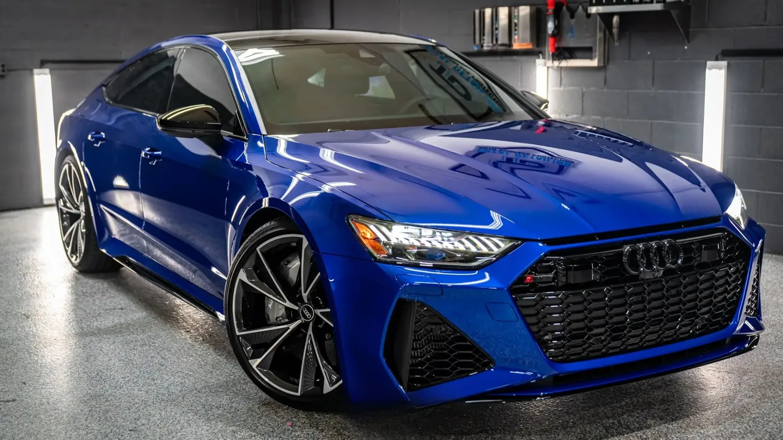 Nogaro blue Audi RS7 front three-quarter, deep metallic flake, gloss ceramic finish