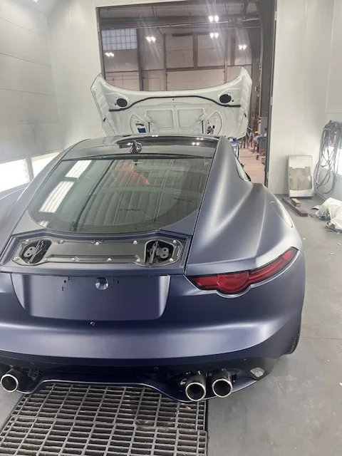 Matte navy Jaguar F-Type rear view with trunk open, full-body PeelClear color change finish